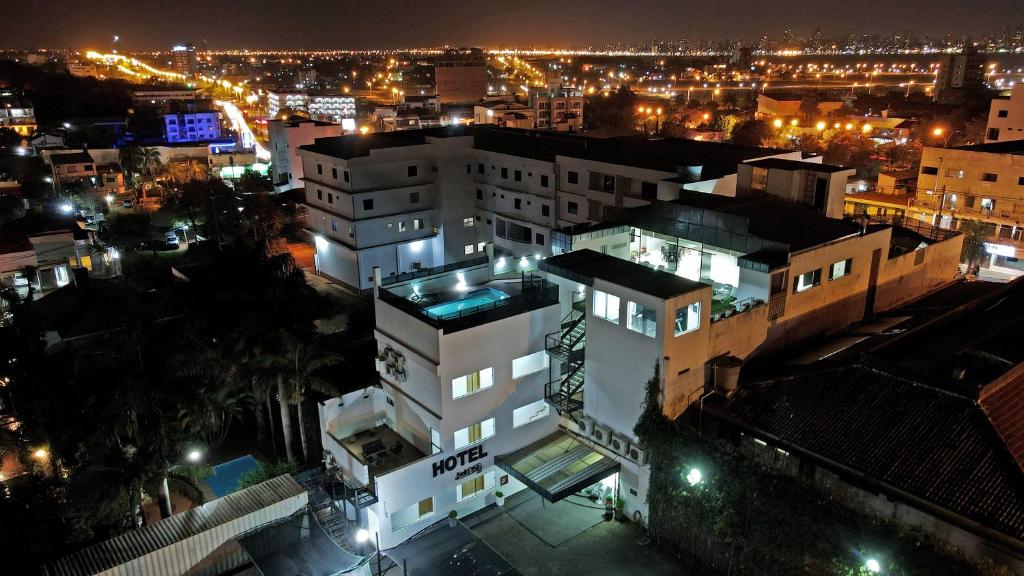 a view of a city at night with lights at Bella Vista Hotel - Encarnación in Encarnación