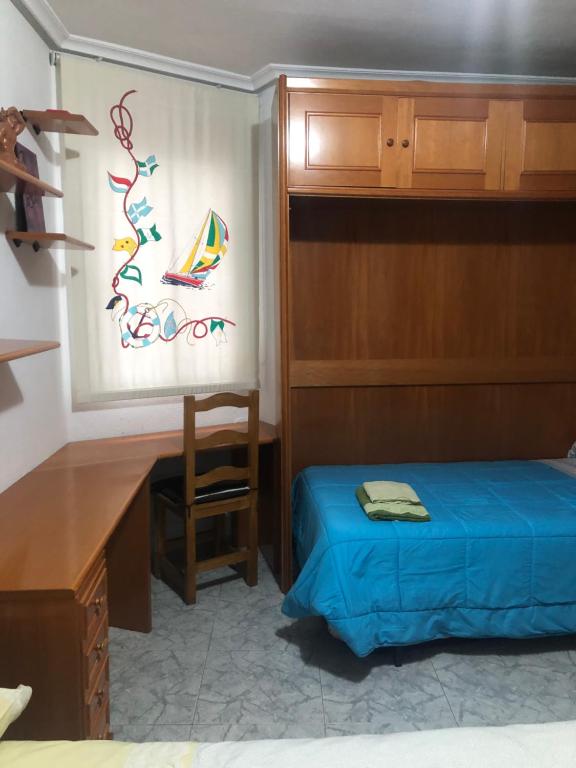 A bed or beds in a room at Peso de la Harina - piso completo