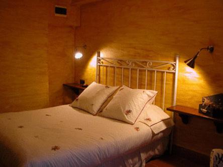 Postel nebo postele na pokoji v ubytování Masia Vista Hermosa