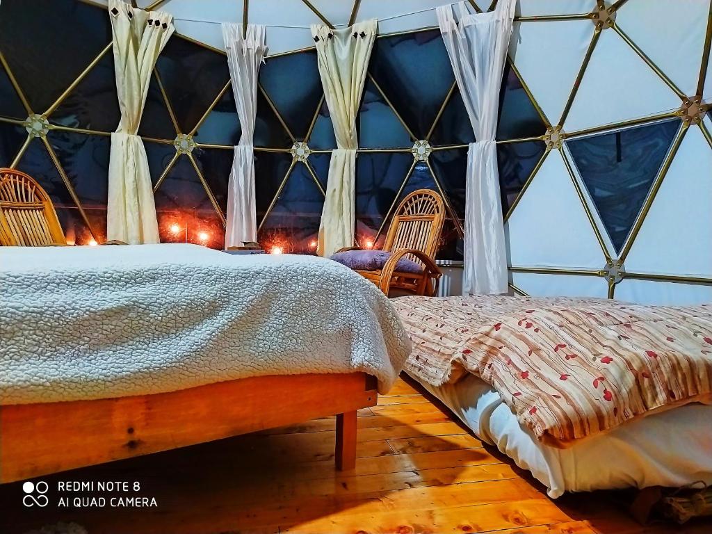 Postel nebo postele na pokoji v ubytování Glamping Chinu