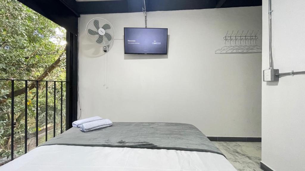 Postel nebo postele na pokoji v ubytování Hotel Casa Malibú