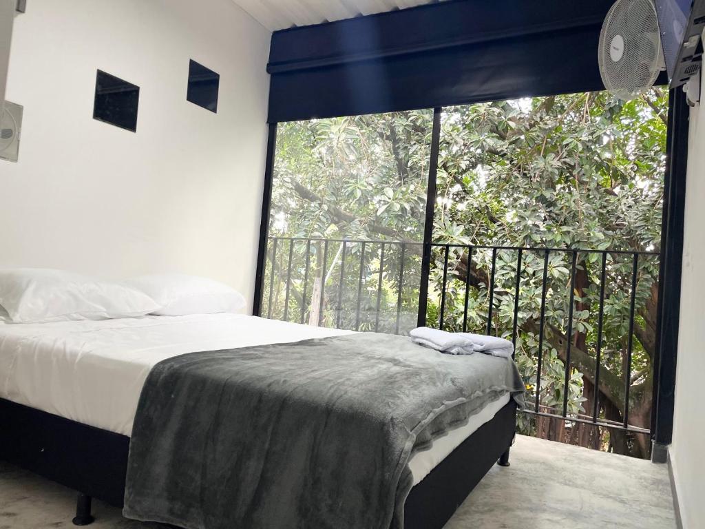 Postel nebo postele na pokoji v ubytování Hotel Casa Malibú