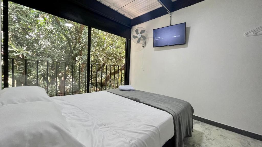 Postel nebo postele na pokoji v ubytování Hotel Casa Malibú