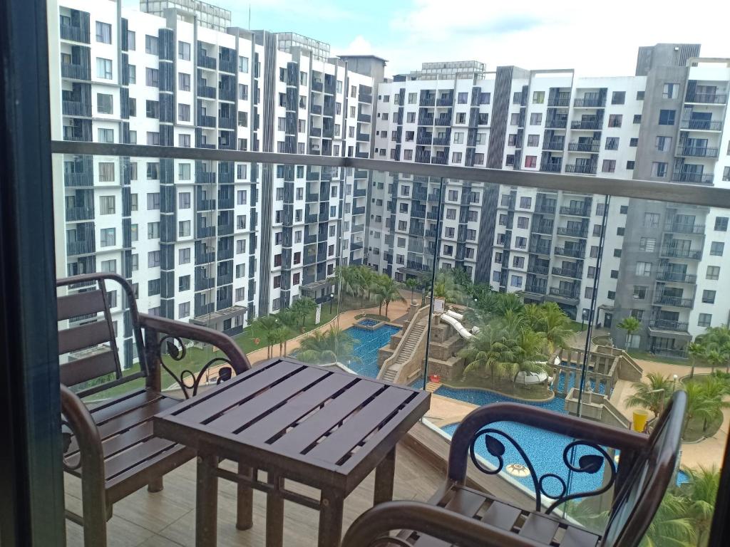a balcony with a table and chairs and a playground at Timurbay Lavender Homestay in Kampung Sungai Karang