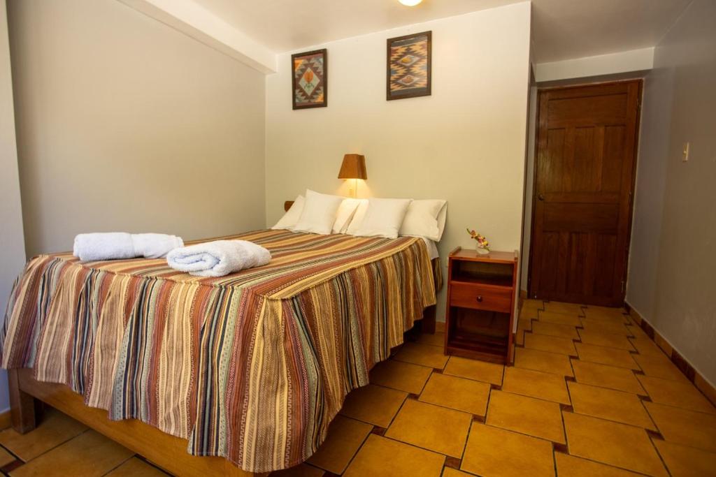Postel nebo postele na pokoji v ubytování Hostal La Payacha MachuPicchu