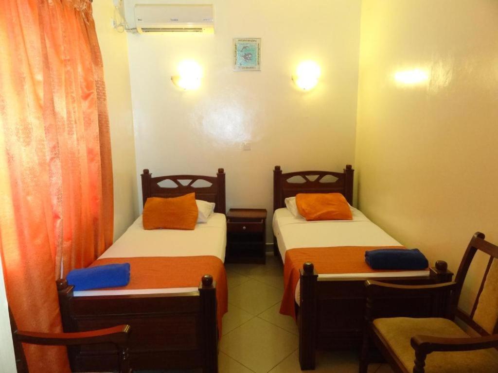 Postel nebo postele na pokoji v ubytování Regency Park Hotel