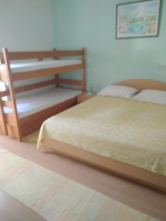 Postel nebo postele na pokoji v ubytování Apartmani Carević