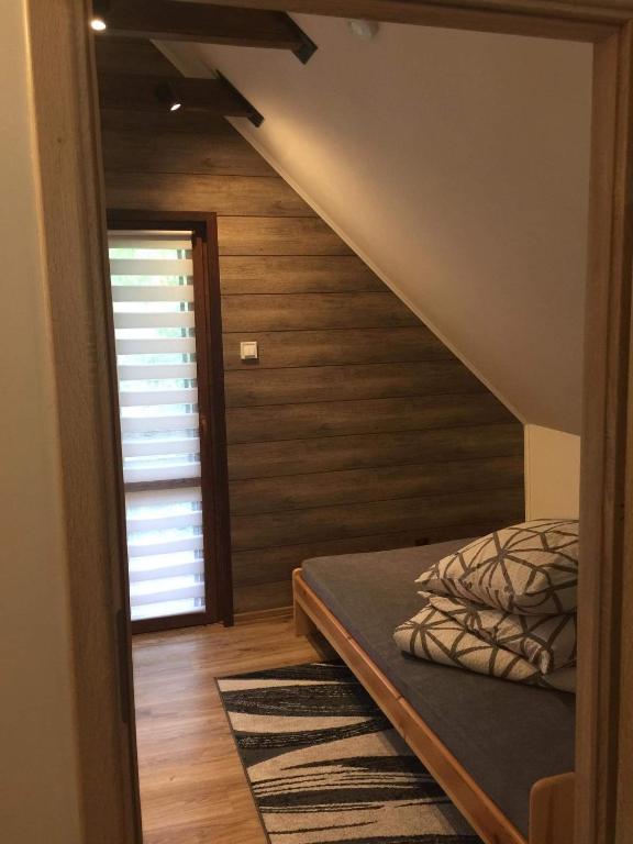 Posteľ alebo postele v izbe v ubytovaní Domek Nad Brzegiem