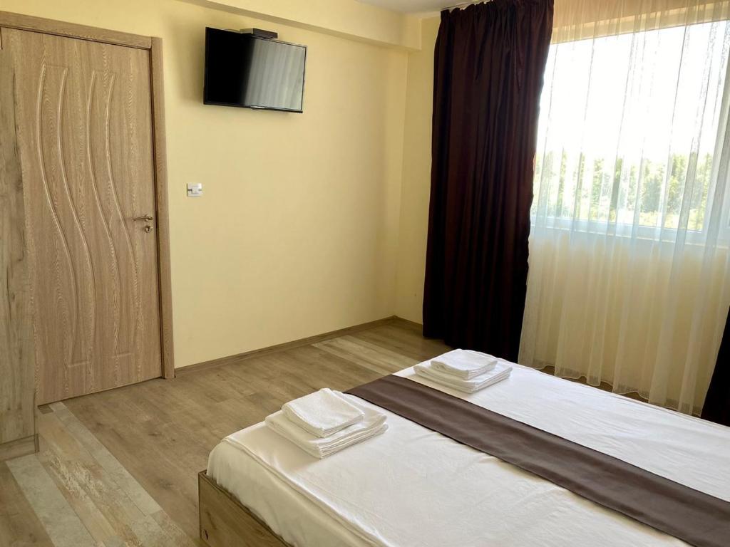 Postel nebo postele na pokoji v ubytování Hotel Sunrise