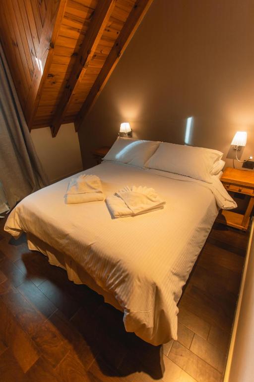 Postel nebo postele na pokoji v ubytování Apart Hotel Agua Escondida