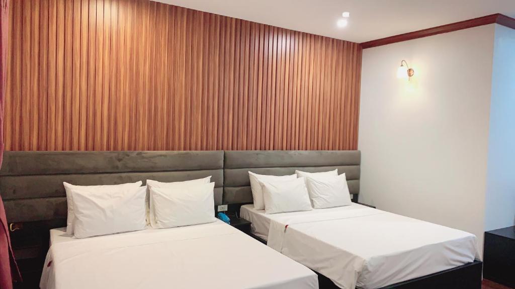 Postel nebo postele na pokoji v ubytování Hotel Red River