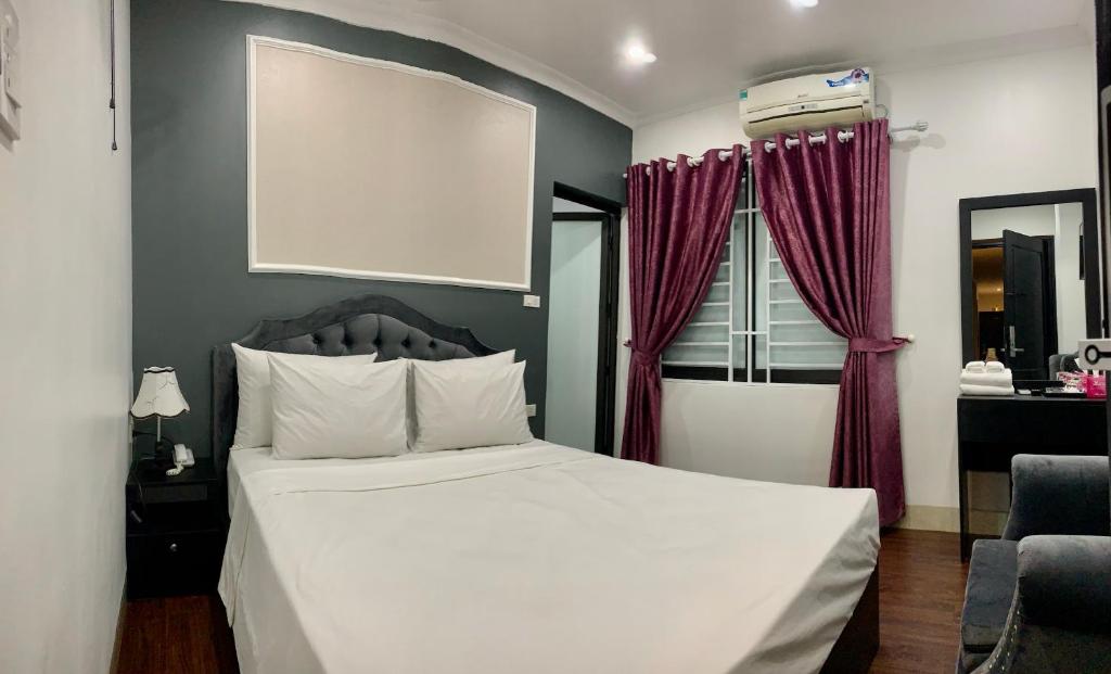 Postel nebo postele na pokoji v ubytování Hotel Red River