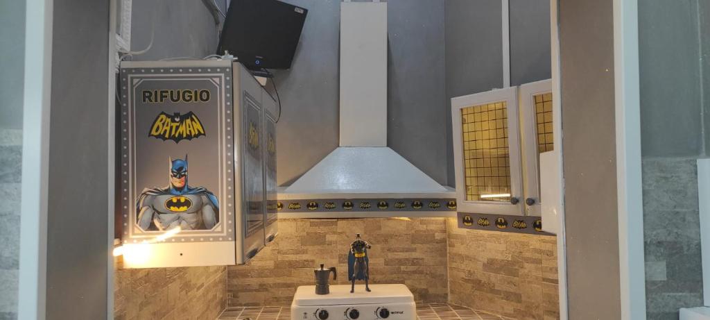a lego bathroom with a batman sign on the wall at Batman Airport Catania City in Catania