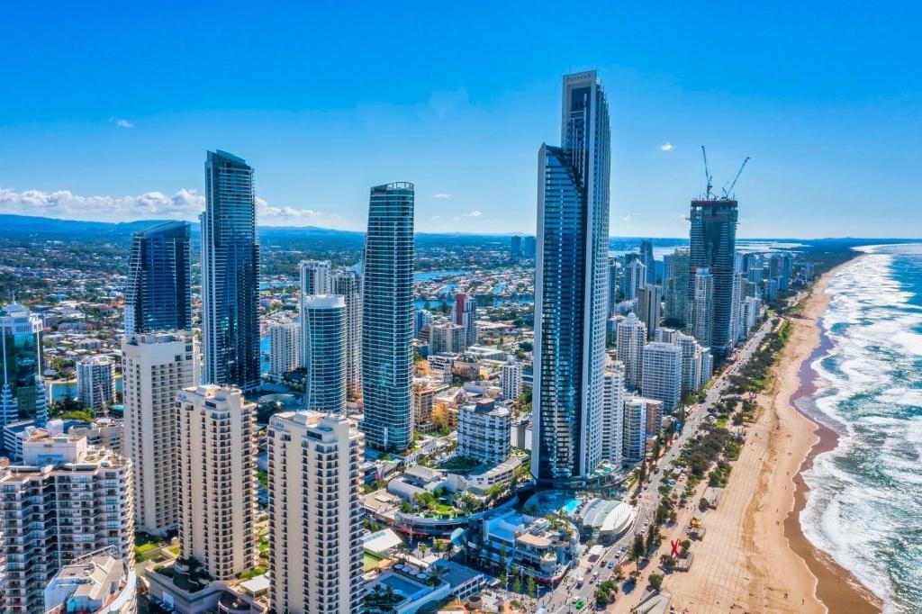 an aerial view of a city with a beach and skyscrapers at H Luxury Residence Apartments - Holiday Paradise in Gold Coast