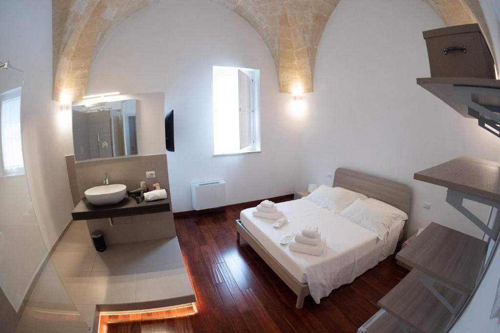 Postel nebo postele na pokoji v ubytování Tulliani Residenze Matera