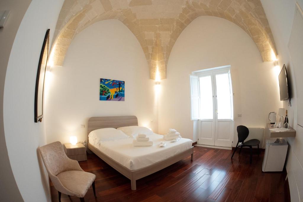 Postel nebo postele na pokoji v ubytování Tulliani Residenze Matera