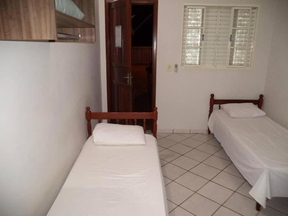 Postel nebo postele na pokoji v ubytování Hotel Comodoro