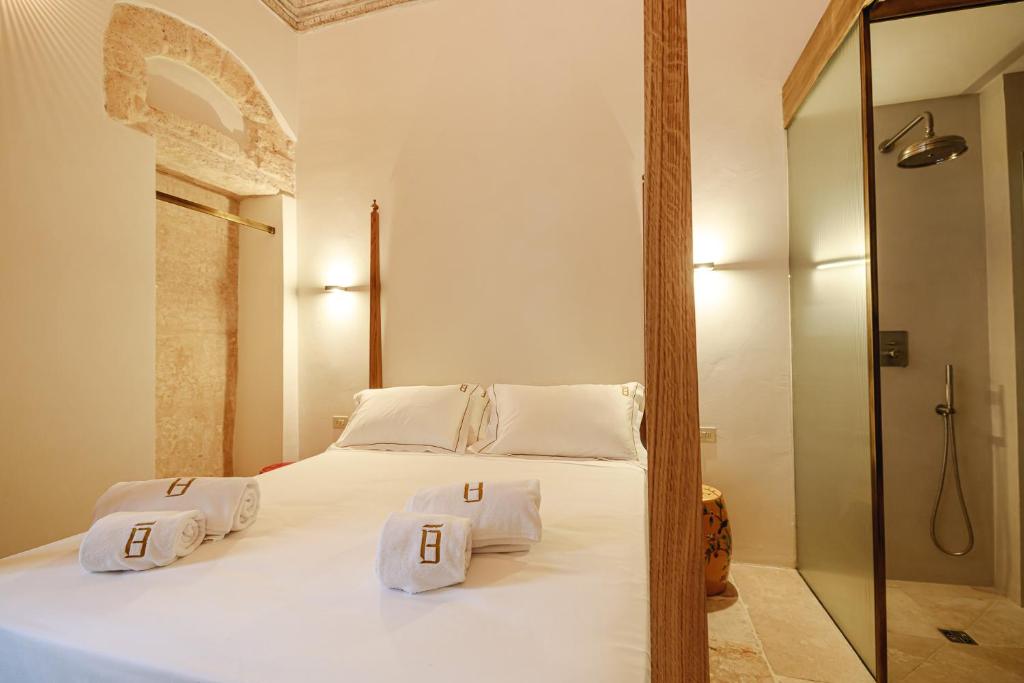 A bed or beds in a room at BAYIT Charming Place