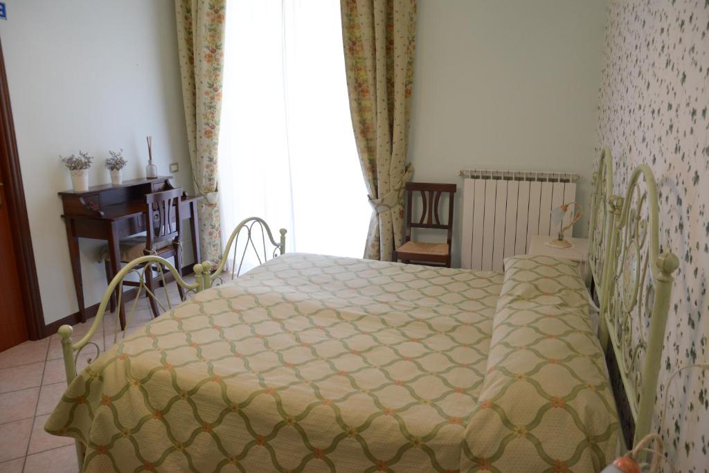 Postel nebo postele na pokoji v ubytování Ai 3 Archi