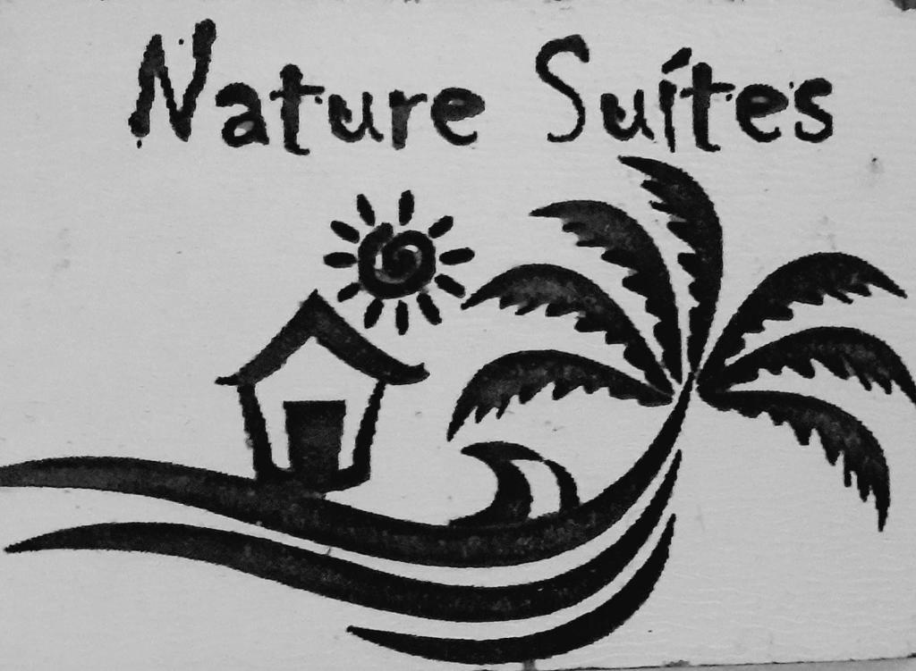 a sign with a picture of a house and a palm tree at NATURE SUÍTES em Ilhabela,próxima as melhores praias do Sul in Ilhabela