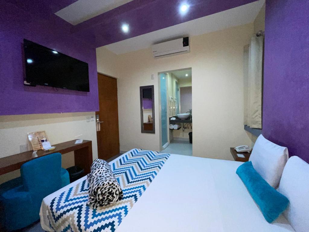 Postel nebo postele na pokoji v ubytování Orizaba Inn