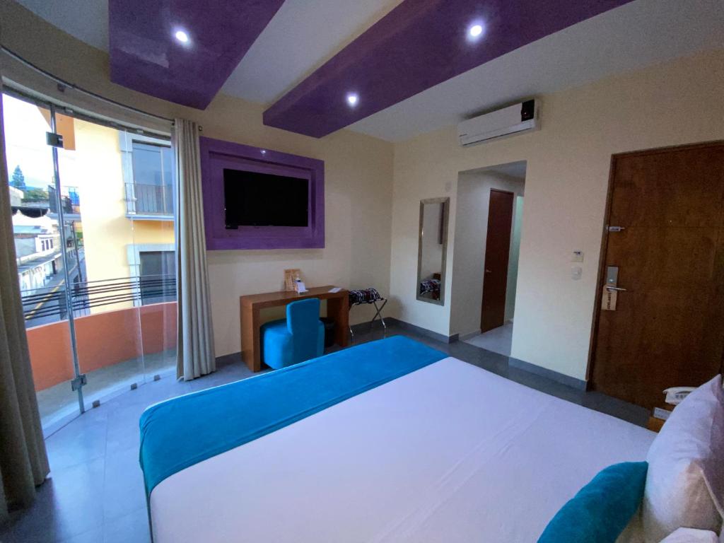 Postel nebo postele na pokoji v ubytování Orizaba Inn