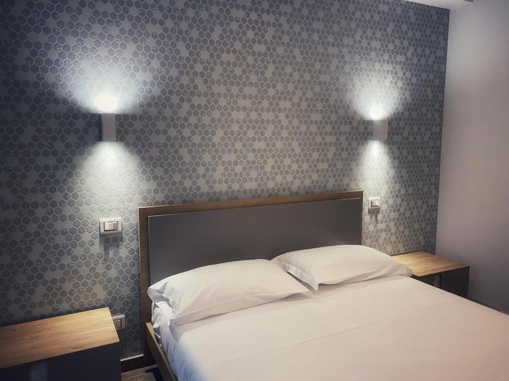 Postel nebo postele na pokoji v ubytování Lumarooms B&B