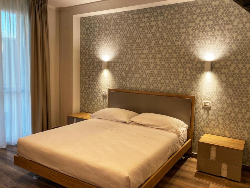 Postel nebo postele na pokoji v ubytování Lumarooms B&B