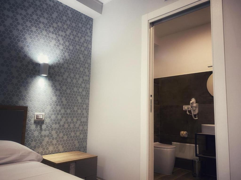 Postel nebo postele na pokoji v ubytování Lumarooms B&B