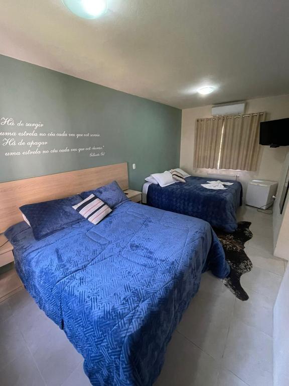 Postel nebo postele na pokoji v ubytování Pousada Pinhão e Poesia