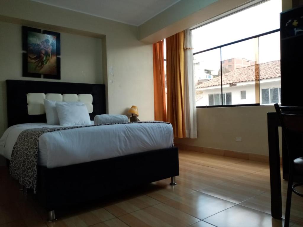 Postel nebo postele na pokoji v ubytování Hotel Mantas Cusco