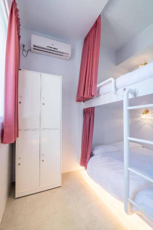 Postel nebo postele na pokoji v ubytování W3 HOSTEL