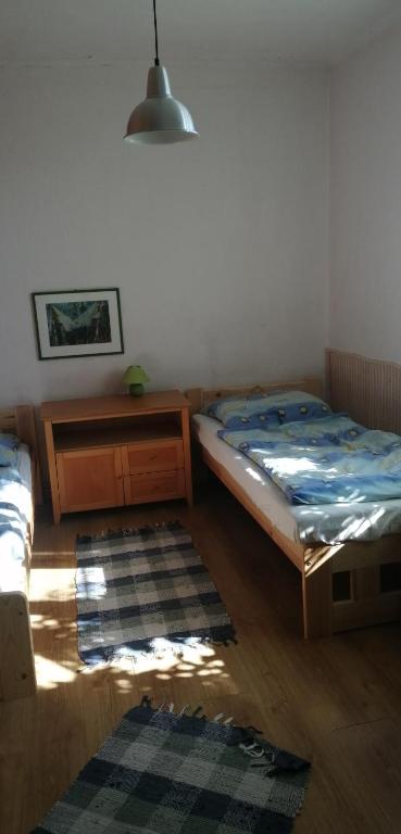 Postel nebo postele na pokoji v ubytování Keramický a výtvarný ateliér Konešín