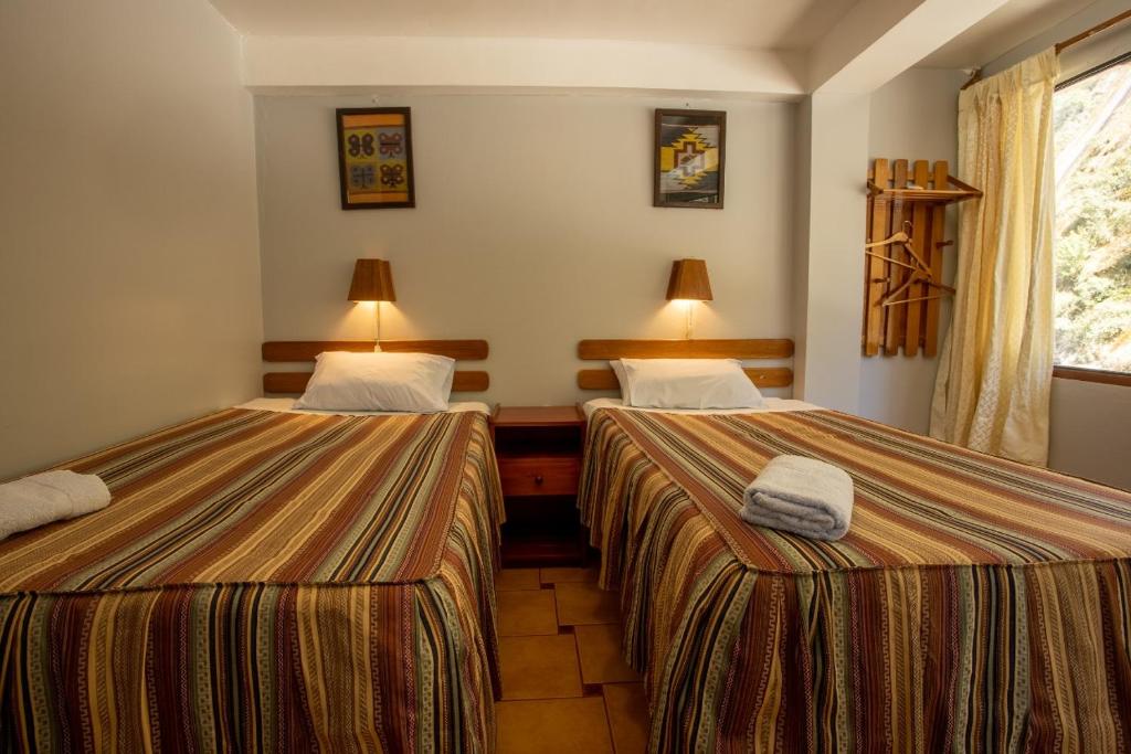 Postel nebo postele na pokoji v ubytování Hostal La Payacha MachuPicchu