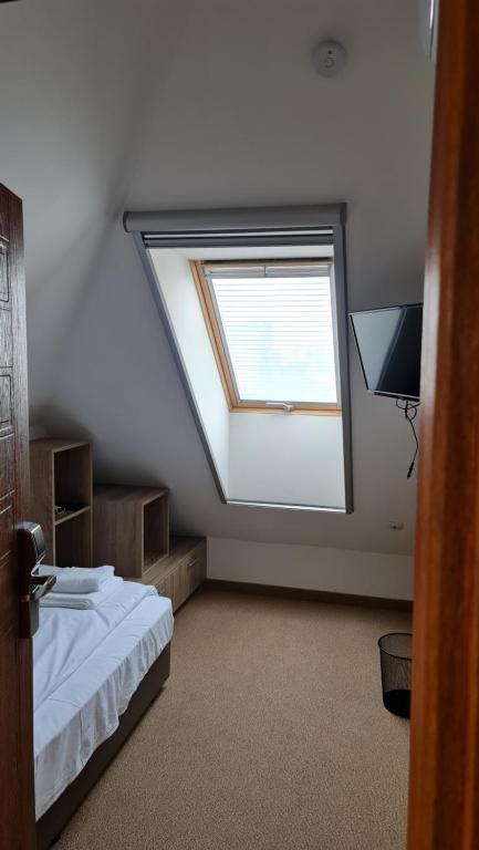Postel nebo postele na pokoji v ubytování Hotel Geppy