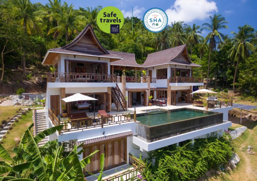 a villa with a swimming pool in a resort at Perfect View Pool Villa in Koh Tao