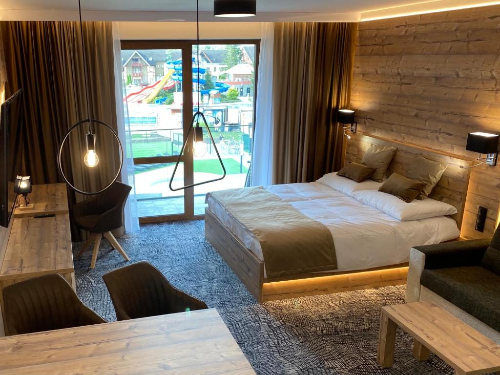 Postel nebo postele na pokoji v ubytování Luxusné štúdia v hoteli Akvamarín Bešenová