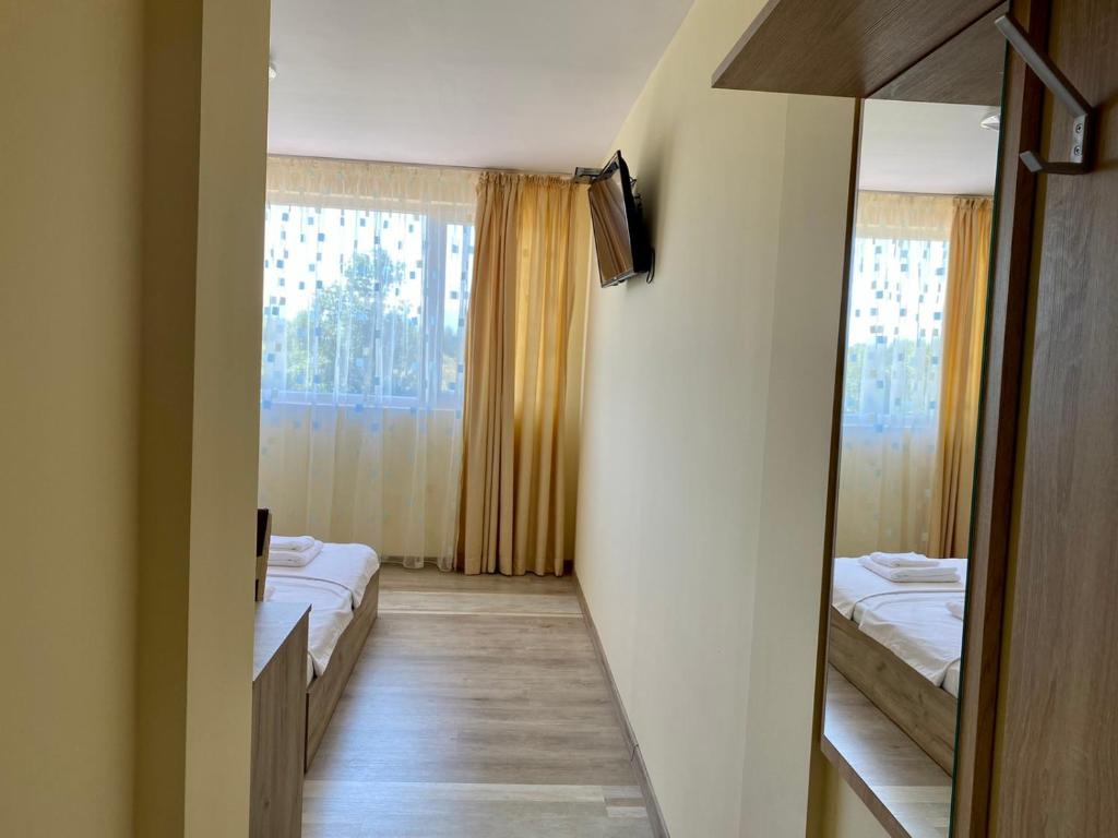 Postel nebo postele na pokoji v ubytování Hotel Sunrise