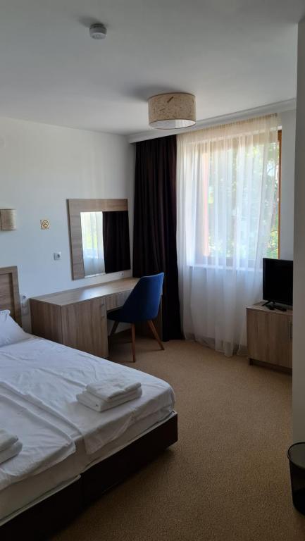 Postel nebo postele na pokoji v ubytování Hotel Geppy