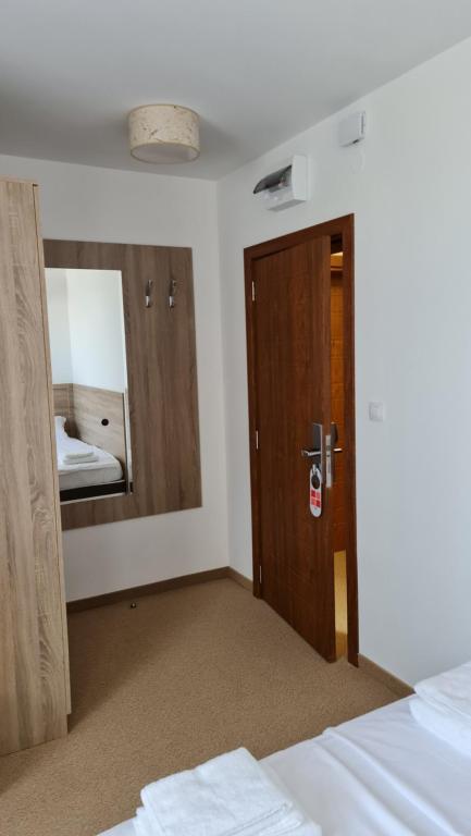 Postel nebo postele na pokoji v ubytování Hotel Geppy