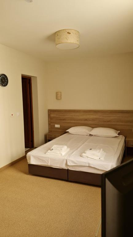 Postel nebo postele na pokoji v ubytování Hotel Geppy