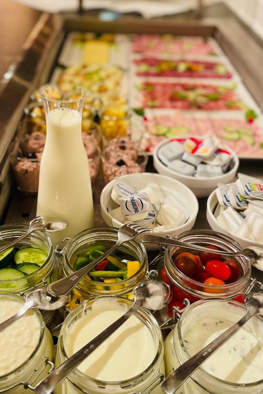 a tray of food with different types of food at Hotel Steinbock in Klosters