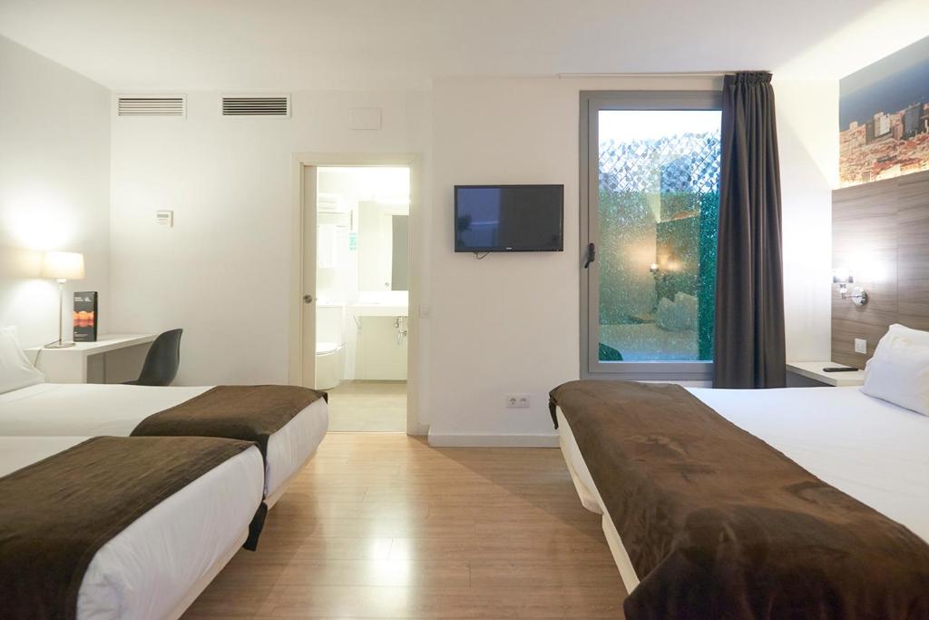Postel nebo postele na pokoji v ubytování Hotel BESTPRICE Diagonal