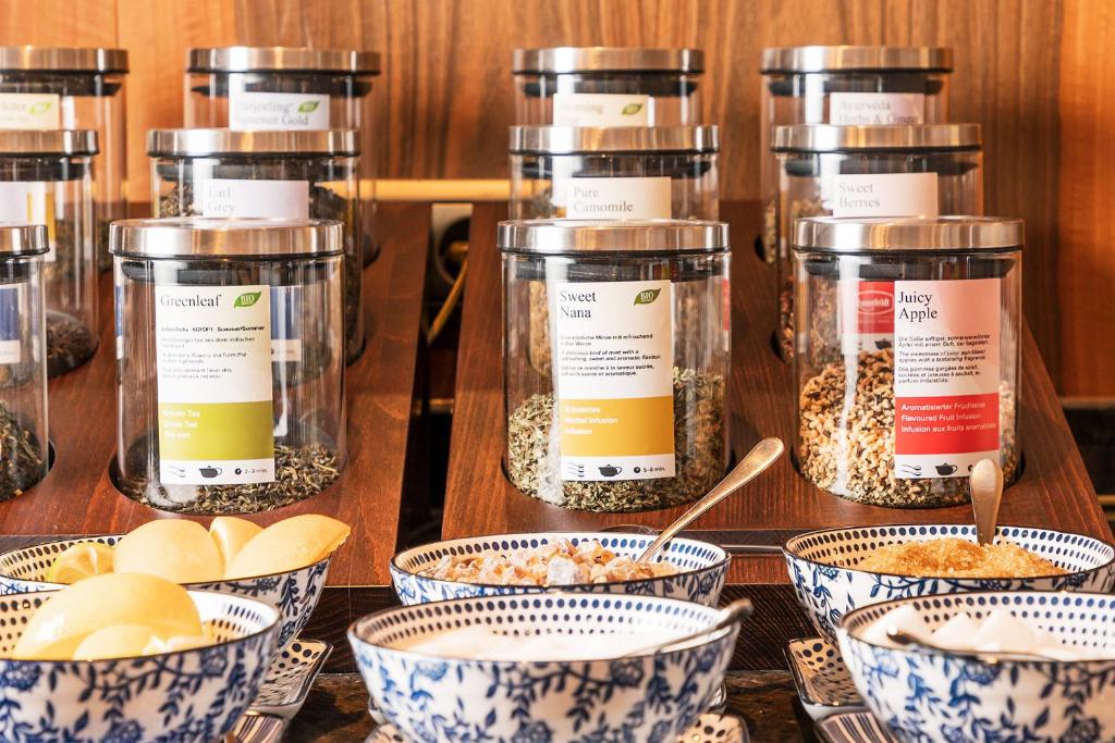 a group of jars of food on a table at Superior Hotel Tirolerhof - Zell am See in Zell am See