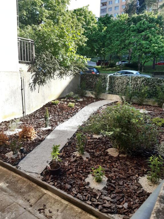 A garden outside Apartment Klimka with balcony, free wifi and free parking