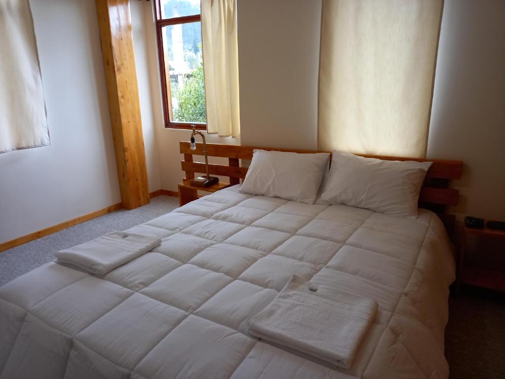 Postel nebo postele na pokoji v ubytování Bonanza Hospedaje
