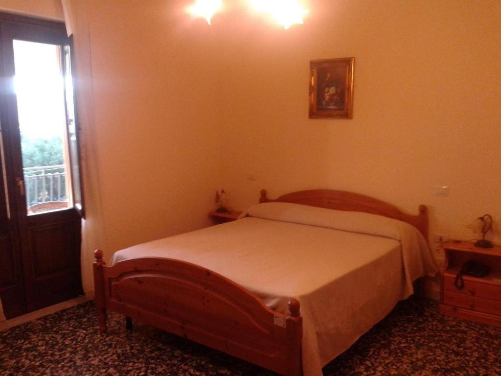 Łóżko lub łóżka w pokoju w obiekcie Casa Vacanze Primula palinuri