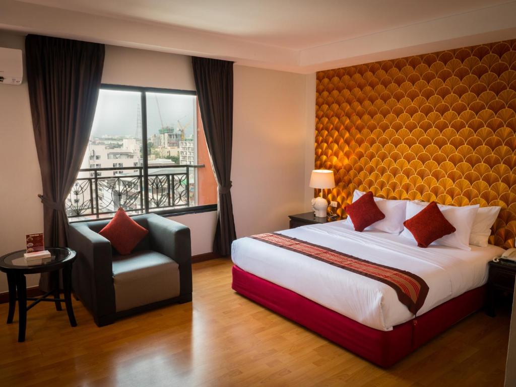 Giường trong phòng chung tại Atrium Boutique Hotel