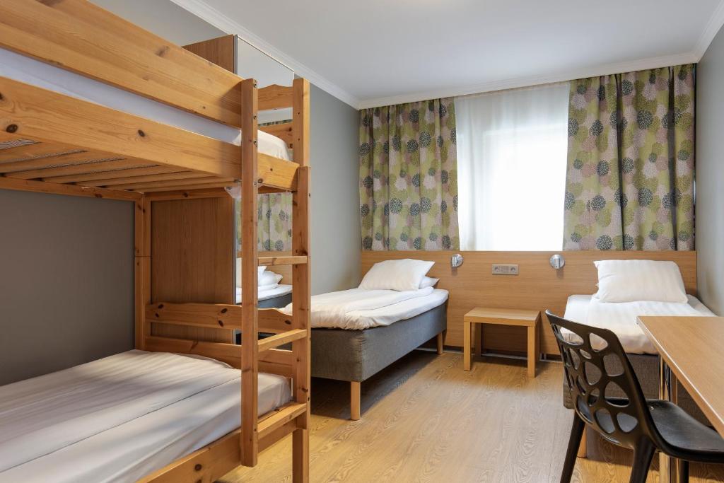 Postel nebo postele na pokoji v ubytování Göteborgs Mini-Hotel