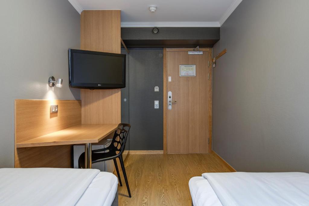 Postel nebo postele na pokoji v ubytování Göteborgs Mini-Hotel
